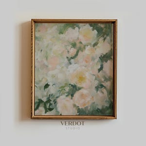 May include: A framed floral painting featuring soft, pastel-colored roses. The artwork has a gold-colored frame and a blurred, impressionistic style. The painting's color palette includes white, light pink, and green hues. The text "VERDOT STUDIO" is at the bottom.