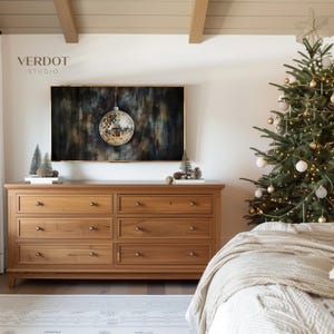 May include: A wooden dresser with six drawers and brass knobs sits in a bedroom with a decorated Christmas tree and a framed abstract painting above it. The text "VERDOT STUDIO" is visible in the top left corner of the image.