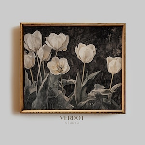 May include: A framed print of a watercolor painting featuring white tulips with dark green leaves on a black background. The frame is a light brown wood.