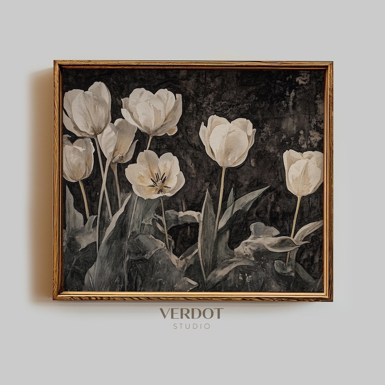 May include: A framed print of a watercolor painting featuring white tulips with dark green leaves on a black background. The frame is a light brown wood.