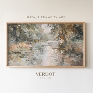 May include: A framed watercolour painting of a forest path leading to a river. The painting is in shades of brown, green, and white, with a soft, dreamy feel. The frame is a simple, light wood.