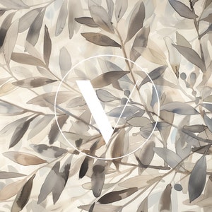 May include: Abstract watercolor painting of a leafy branch with a white circle and the letter "V" in the center. The leaves are in shades of brown and gray.