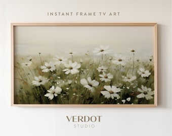 May include: A framed painting of a field of white wildflowers with a soft, green background. The painting has a light, airy feel and is perfect for adding a touch of nature to any room.