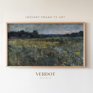 May include: A framed painting of a field of wildflowers with a forest in the background. The sky is a muted blue with a hint of pink in the distance. The painting is in a simple wooden frame.