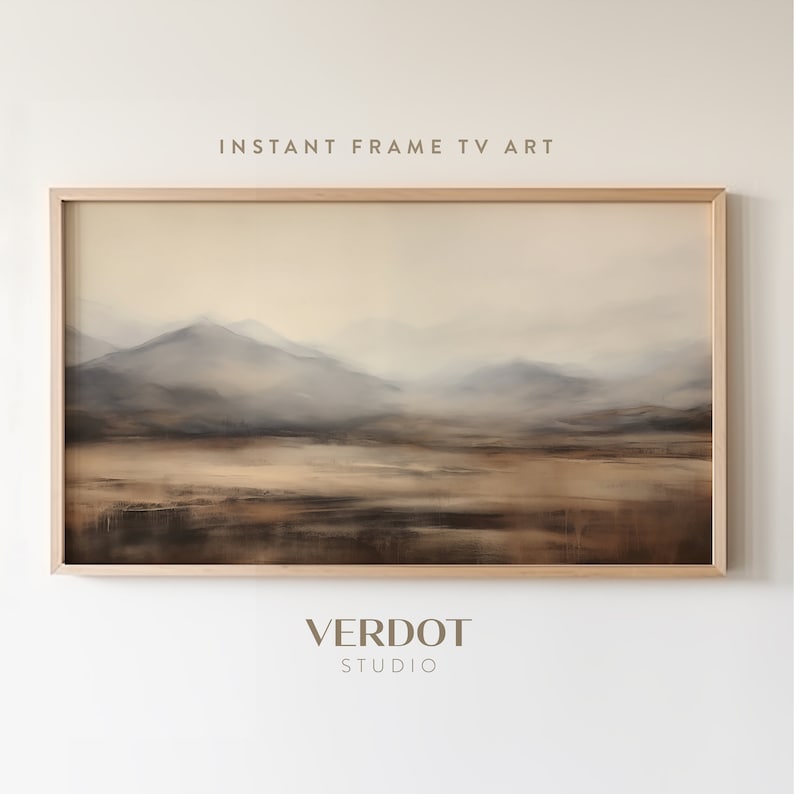 May include: A framed abstract painting of a misty mountain landscape in shades of brown, beige, and gray. The painting is titled "Instant Frame TV Art" and is by "Verdot Studio".