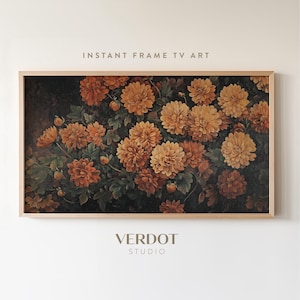 May include: A framed print of a painting featuring a cluster of orange and yellow chrysanthemums with green leaves against a dark background. The frame is a light wood color.