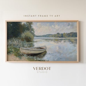 May include: A painting of a lake scene with a small white boat in the foreground. The lake is surrounded by trees and there are clouds in the sky. The painting is framed in a light wood frame.