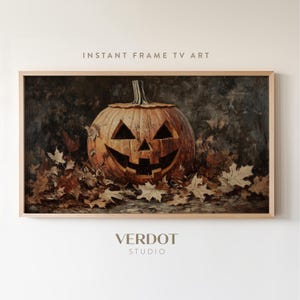 May include: A carved orange pumpkin with a toothy grin sits on a bed of brown autumn leaves. The pumpkin is lit from the inside, casting a warm glow on the leaves.