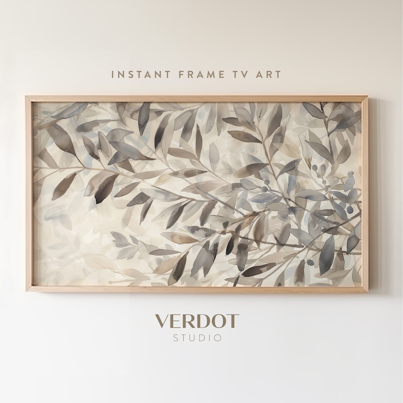 May include: A framed watercolor painting of a branch with leaves in shades of gray and brown. The background is a light beige color. The painting is titled "INSTANT FRAME TV ART" and is signed "VERDOT STUDIO".