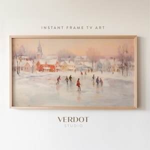 May include: A framed painting depicting a winter scene with a small town and people ice skating on a frozen lake. The sky is a soft pink and orange, and the trees are bare. The painting is in a light wood frame.