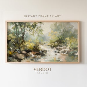May include: A framed painting of a forest scene with a stream flowing through it. The painting is done in a loose, impressionistic style with shades of green, brown, and white. The text "INSTANT FRAME TV ART" is at the top of the image and "VERDOT STUDIO" is at the bottom.