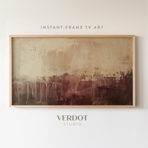 May include: Abstract painting in shades of brown, beige, and white with a wood frame. The painting has a textured, layered look with drips of paint. The text "INSTANT FRAME TV ART" and "VERDOT STUDIO" is visible below the painting.