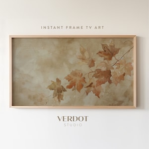 May include: A framed watercolor painting of a branch with brown leaves on a beige background. The painting is in a light wood frame. The text "INSTANT FRAME TV ART" is above the painting and the text "VERDOT STUDIO" is below the painting.