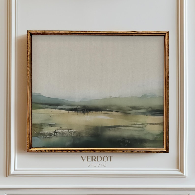 May include: A framed abstract landscape painting in shades of green, brown, and white. The painting is in a gold frame and has the text "VERDOT STUDIO" below it.