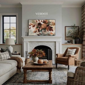 May include: A rectangular wall art print featuring an oil painting of a floral bouquet in warm autumn tones of orange, brown, and deep red. The artwork is displayed above a white fireplace mantel with the text VERDOT STUDIO printed above it.