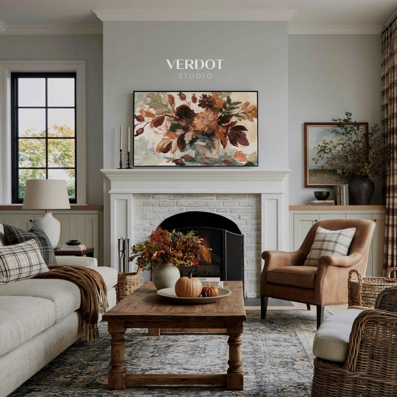 May include: A rectangular wall art print featuring an oil painting of a floral bouquet in warm autumn tones of orange, brown, and deep red. The artwork is displayed above a white fireplace mantel with the text VERDOT STUDIO printed above it.