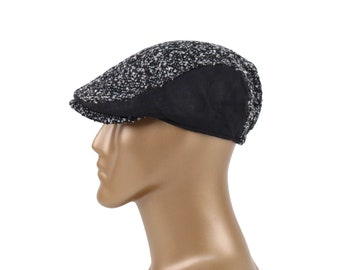 Coppola in misto lana nera: elegante cappello da newsboy in stile edera