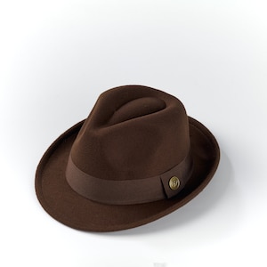 May include: A brown fedora hat with a brown ribbon and a gold button.