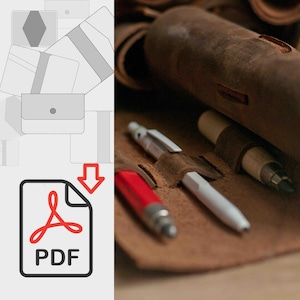 May include: A brown leather pencil case with three pencils inside. The case has a flap with a snap closure. The pencils are a red mechanical pencil, a white mechanical pencil, and a wooden pencil with a brown eraser.