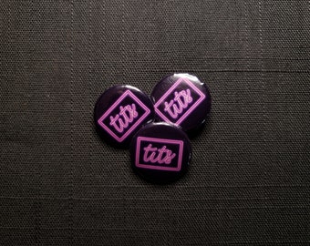 TITS neon sign 1 inch Button Pins - Metalocalypse, Dethklok