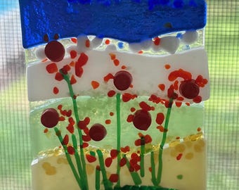 Kleines geschmolzenes Glas hängend mit Blumen