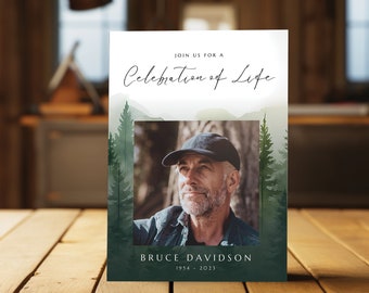 May include: A white card with a green watercolor background featuring a mountain range and pine trees. The card reads "Join us for a Celebration of Life" and includes a photo of a man with a black baseball cap. The text "Bruce Davidson 1954 - 2023" is printed at the bottom of the card.