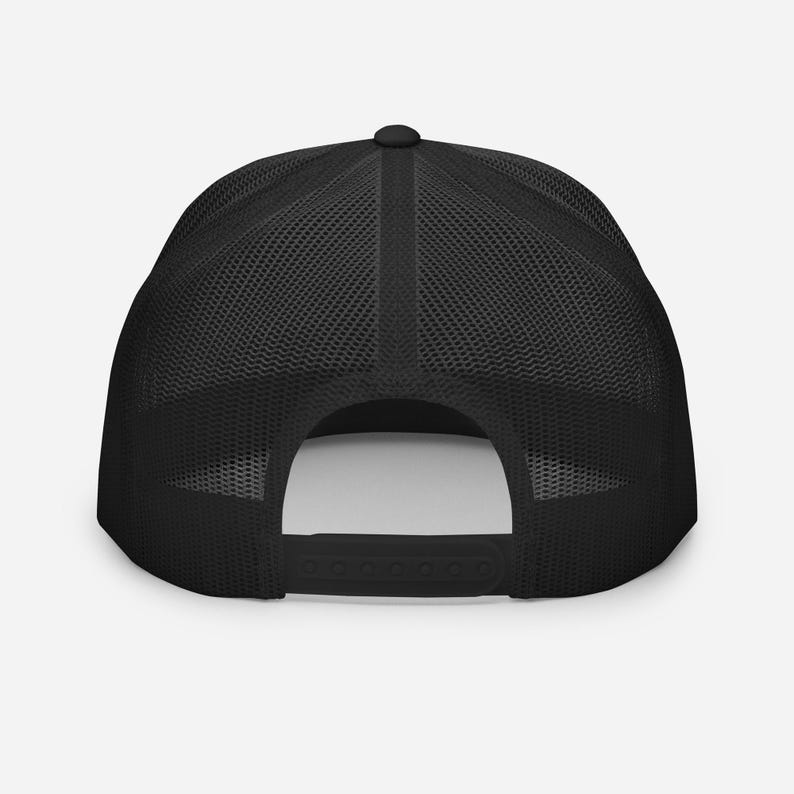 May include: Black mesh trucker hat with a black front panel and a black adjustable strap.