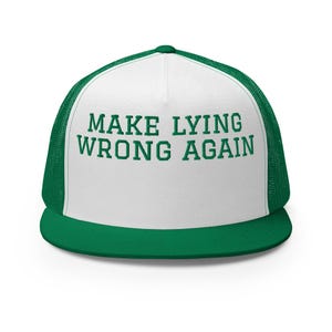May include: White trucker hat with a green mesh back. The front of the hat has the text "MAKE LYING WRONG AGAIN" in green.