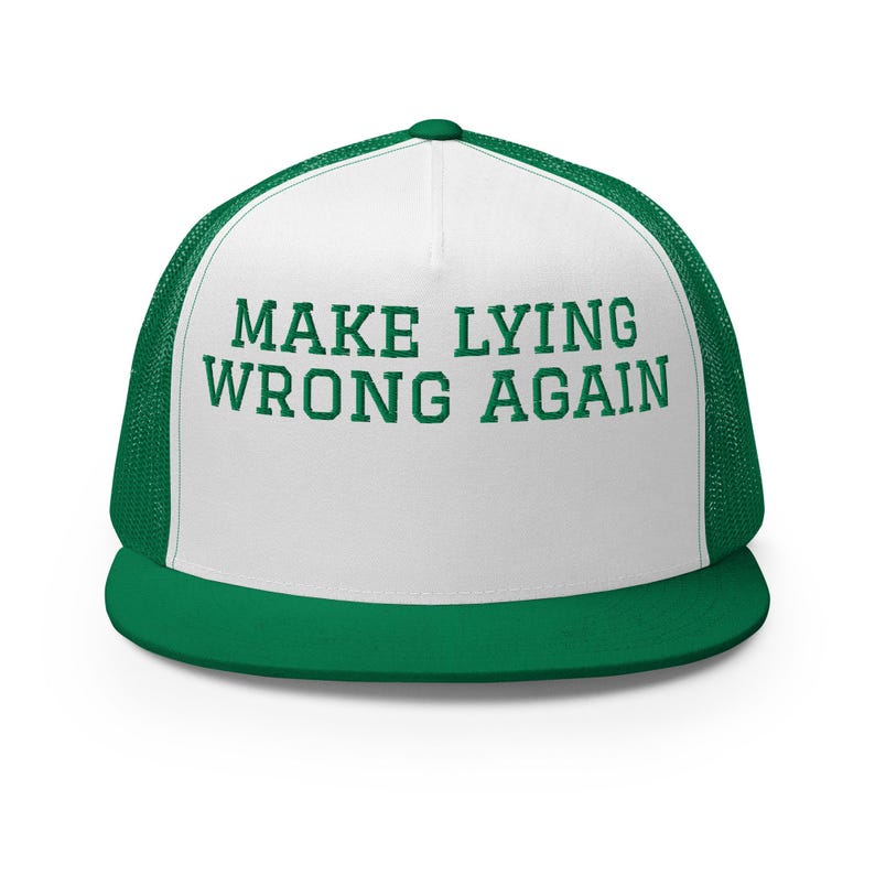 May include: White trucker hat with a green mesh back. The front of the hat has the text "MAKE LYING WRONG AGAIN" in green.