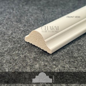 May include: White decorative molding with a rounded edge and a slight curve. The molding is 4 inches long and 2.5 inches wide. -FRONT VIEW- CHARM wallcreations.