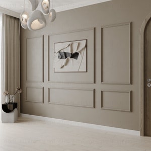 May include: A beige wall with white trim and a framed abstract art print. The wall is divided into sections by the trim, creating a grid pattern. A white door is on the right side of the image.