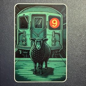 May include: A sticker featuring a black sheep standing on a subway platform in front of a green subway car. The car has the number 9 in a red circle. The background is a dark green.