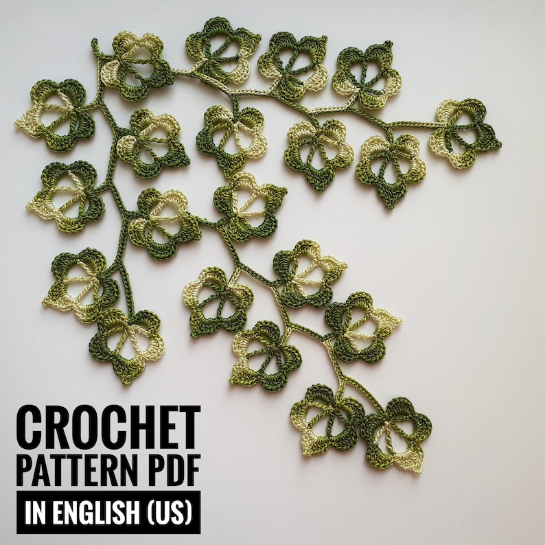 May include: A crochet pattern PDF for a leafy branch design in green and white. The pattern is written in English (US).