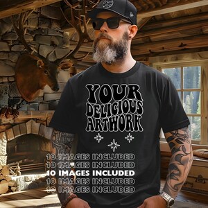 May include: A black t-shirt with white text that reads "YOUR DELICIOUS ARTWORK" in a retro font. There are three white stars below the text. The t-shirt is being worn by a person with a beard and tattoos.