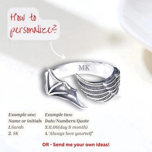 May include: A silver ring with a wing and bat wing design. The ring has the initials "MK" engraved on it. The image includes text that says "How to personalize?" and provides examples of personalization, including names, initials, dates, and quotes.