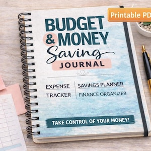 May include: A white ceramic mug with a black handle and the text "But First, Coffee" in a bold, black font. The mug is set against a blurred background, suggesting a cozy setting.