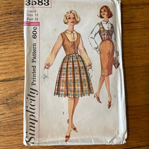 May include: Vintage Simplicity sewing pattern envelope for a junior size 13 dress with a 33 inch bust. The pattern is for a plaid skirt with a brown vest and a white blouse. The envelope is labeled "Simplicity Printed Pattern 60c".
