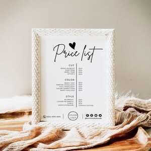 Op de afbeelding: Een witte lijst met prijzen voor een kapsalon met een hartje en de tekst "Price list". De lijst bevat diensten zoals knippen, trimmen, kleuren, highlights, f&ouml;hnen en haarverlenging met de prijzen naast elke dienst.