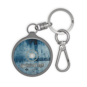 Chaveiro com o título do álbum dos Backstreet Boys