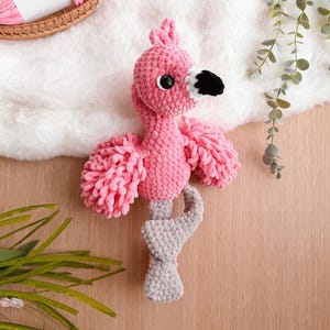 May include: A white ceramic mug with a black handle and the text "But First, Coffee" in a bold, black font. The mug is set against a blurred background, highlighting its clean design.