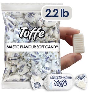May include: A clear plastic bag filled with individually wrapped white Toffe mastic flavor soft candies. The bag is labeled "Toffe" and "MASTIC FLAVOUR SOFT CANDY" and weighs 2.2 lb. A single candy is held up, showing its shape.