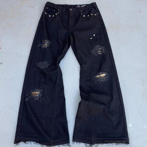 Custom distressed camo patched studded flared black denim jeans