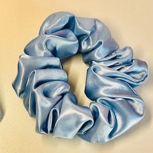 Sky Blue satin scrunchies in regular sizes. Hand made scrunchies in jumbo and regular sizes in satin, flannel and cotton