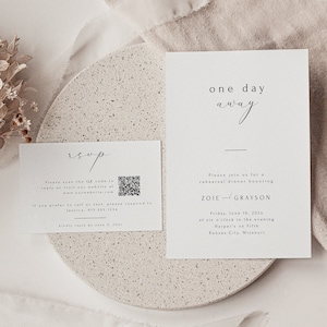 May include: A white RSVP card with a black QR code and text that reads "Please scan the QR code to reply or visit our website at www.ourwebsite.com. If you prefer to call or text, please respond to Jessica, 913.555.1234. Kindly reply by June 2, 2024."  A white invitation card with black text that reads "One day away. Please join us for a rehearsal dinner honoring Zoie and Grayson. Friday, June 16, 202x at six o'clock in the evening Harper's on Fifth Kansas City, Missouri."