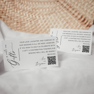 May include: Two white cards with black text and a QR code. The text reads "Your love, laughter, and company at our wedding is all we need. However, if you wish to help us celebrate with a gift, a contribution towards our wishing well will be warmly received." The cards also include the names "Ave and Benjamin".