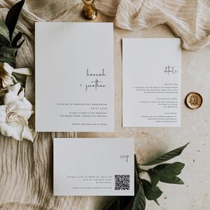 May include: A white wedding invitation suite with a simple design. The invitation features the names "Hannah + Jonathan" in black script font. The details card includes information about the reception, accommodations, and RSVP details. The RSVP card has a QR code for guests to respond.