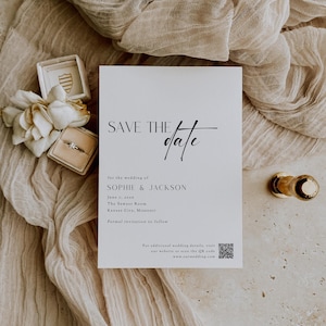 May include: Save the date card with a black and white design. The card says "Save the date" with a handwritten style font. The card also includes the names Sophie & Jackson, the date June 7, 2018, the location The Sawyer Room, Kansas City, Missouri, and the text "Formal invitation to follow".
