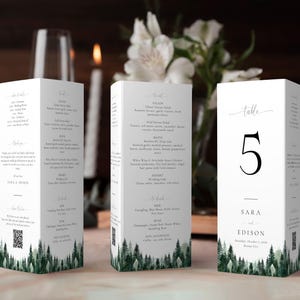 May include: White table number card with a black number 5, the text "Table" and the names "Sara and Edison" with a forest green background.