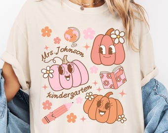 Personalized Halloween kindergarten teacher shirt, Custom Name kindergarten halloween shirts, cute pumpkin teaching shirt, kindergarten team