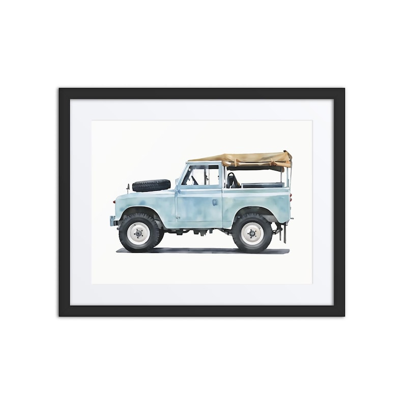 May include: Framed print of a light blue vintage SUV with a tan canvas roof. The vehicle has black tyres and a spare tyre on the bonnet. The artwork is a watercolour style painting.